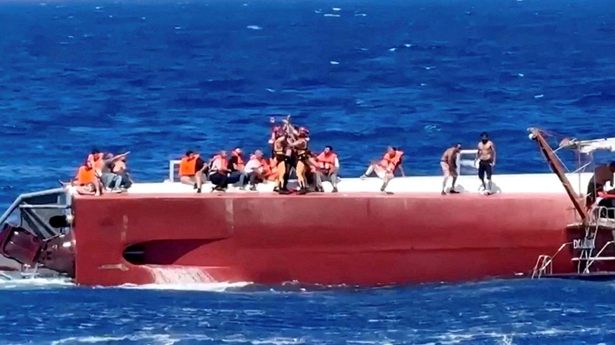 A passenger is rescued from a capsized private ferry off Northern Cyprus.