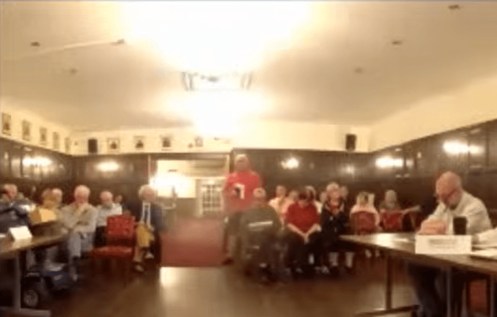 Peter Neal standing up in Attleborough Town Council
