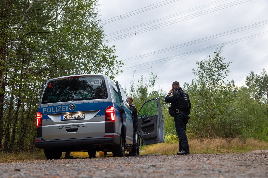 Police officers in Saxony are investigating unknown explosive devices found in a wooded area under a power line.