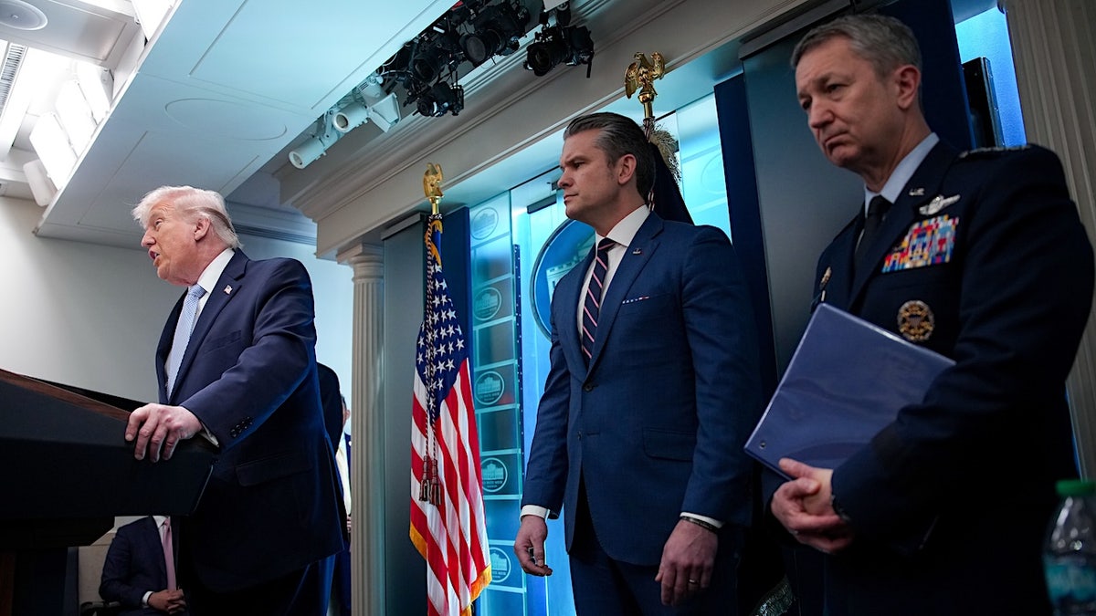 president donald trump, war secretary pete hegseth and chair of the joint chiefs of staff gen. Dan Caine at a news conference