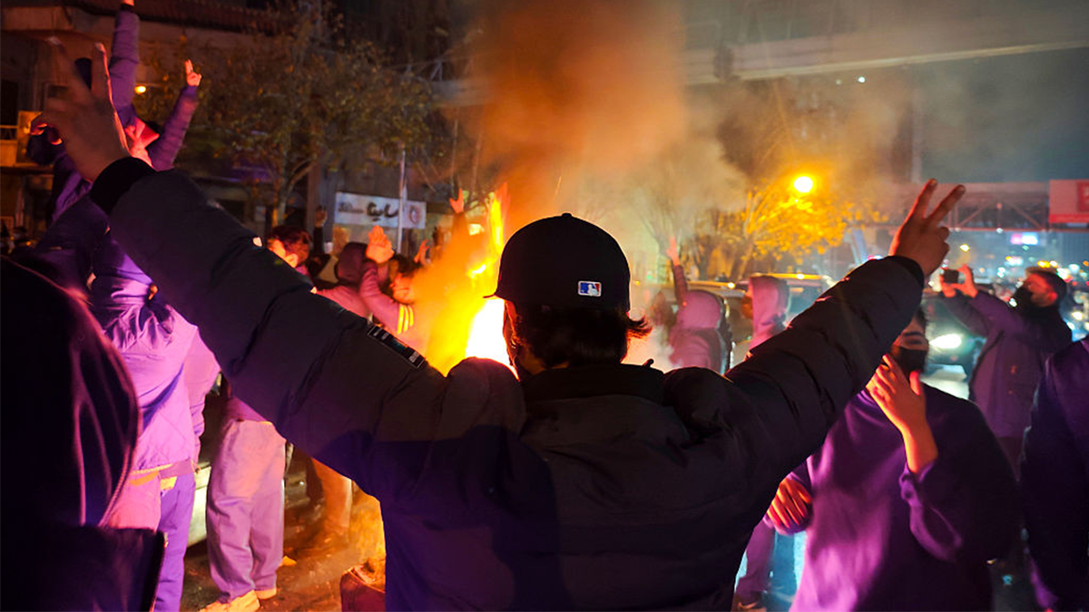 Fires are lit as protesters rally in Iran