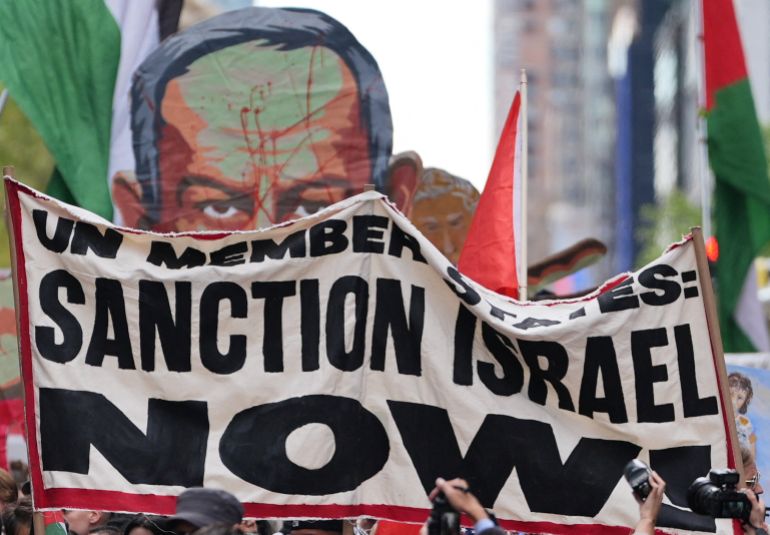 Demonstrators display a banner as they protest after Israeli Prime Minister Benjamin Netanyahu's address to the United Nations 81st General Assembly in New York City, U.S., September 24, 2026. REUTERS/David 'Dee' Delgado