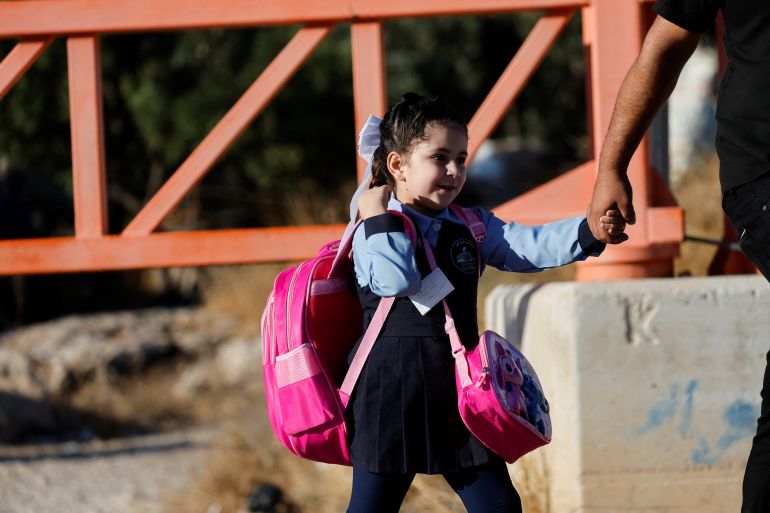A Palestinian student crosses an Israeli checkpoint as students return to school for the new academic year, near Hebron in the Israeli-occupied West Bank, September 6, 2026. REUTERS/Mussa Qawasma