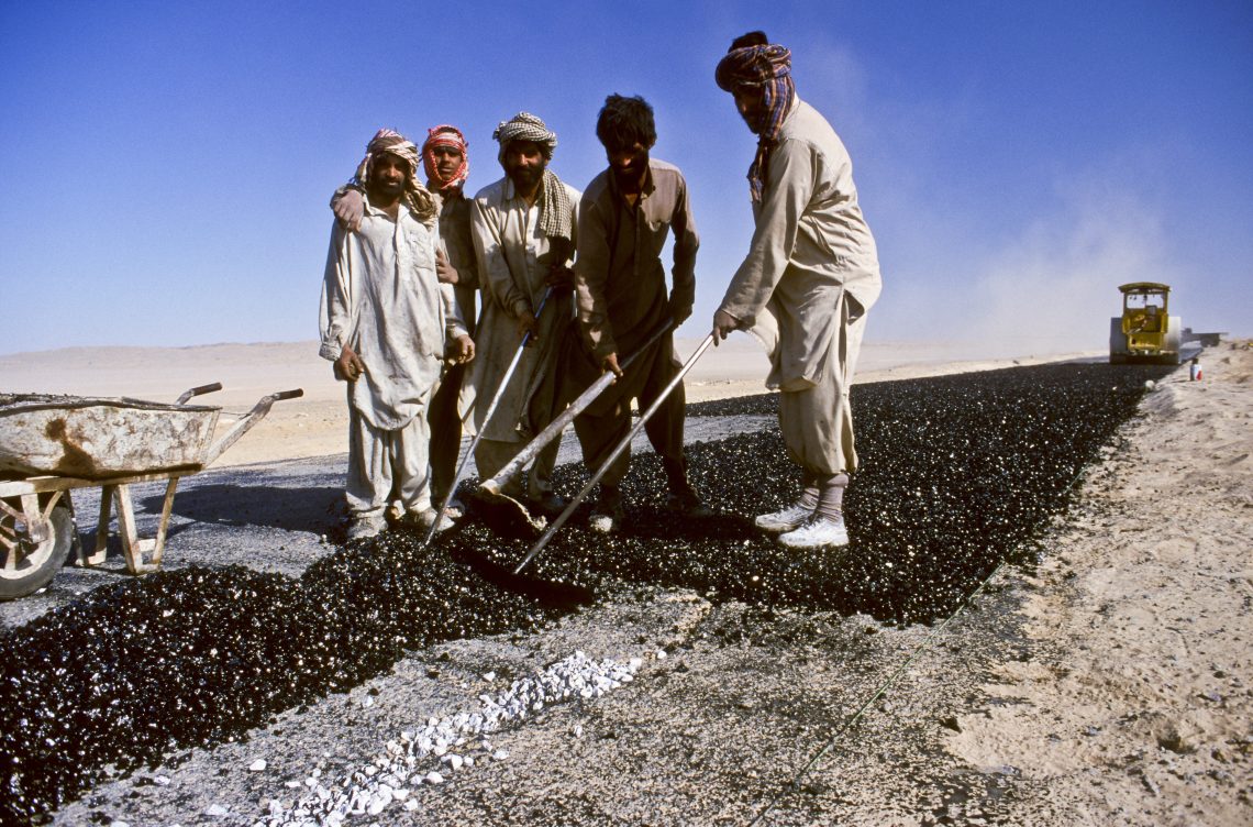 Workers paving a road between Taftan, a town on Pakistan’s border with Iran, and Quetta, the capital of the province of Balochistan, in the year 2000.Transport links between Pakistan and Iran are now crucial for Iran’s economic survival.