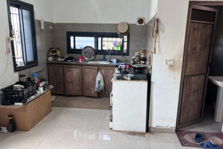 The kitchen and bathroom the Zbeidats have are in the same room they sleep in [Al Jazeera]