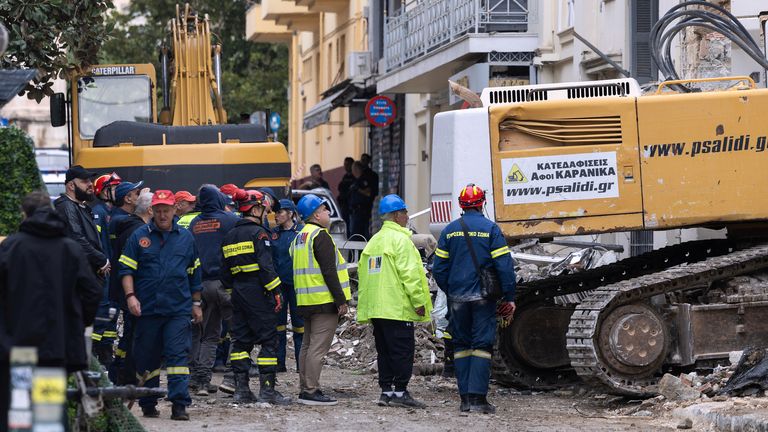 Rescuers work at the scene following Friday's powerful blast in Athens' Plaka district. Pic: PA