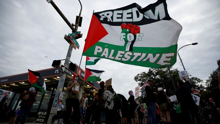 Protesters gather near the venue. Pic: Reuters