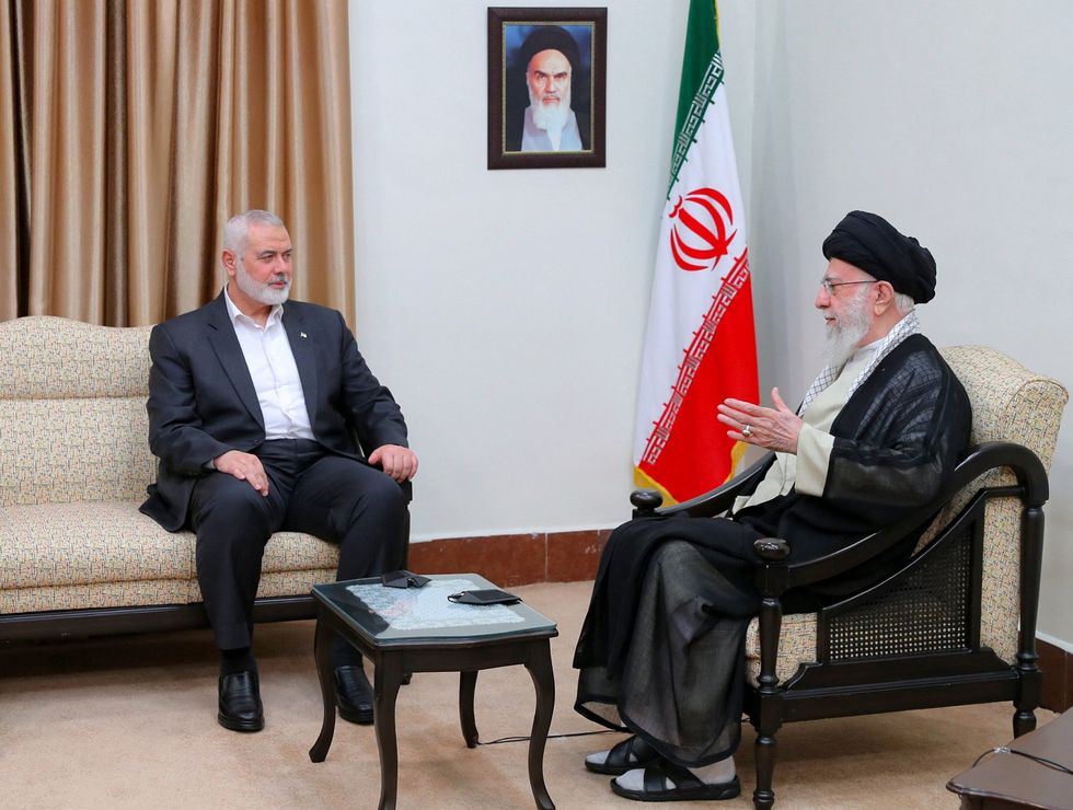 \u200bThe bodyguard's former boss, Ismail Haniyeh, with the now-dead Ayatollah Khamenei