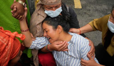 Photos show a family in Nepal bid farewell, as other flood victims are buried in unmarked graves