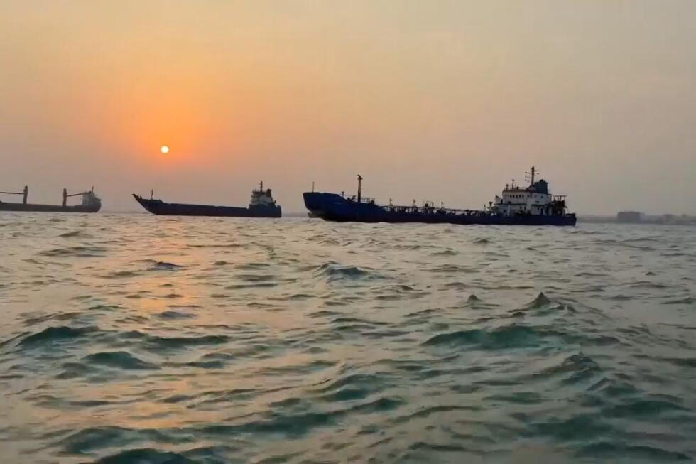 Vessels seen on Strait of Hormuz by Bandar Abbas, Iran as sun sets