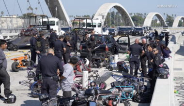 Scores of minibike riders penned in and arrested on 6th Street Bridge