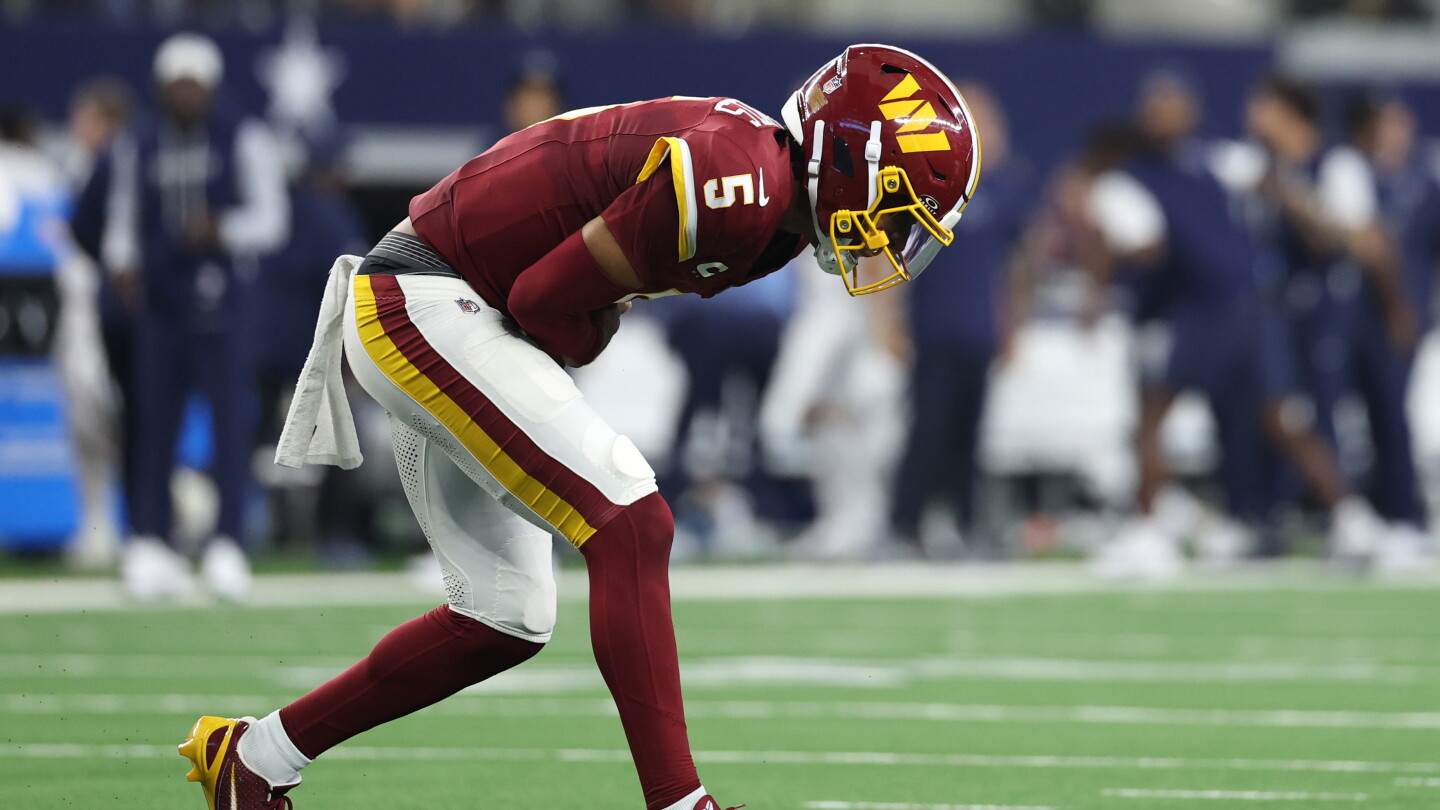 Jayden Daniels consulting specialists after dislocating left elbow Sunday