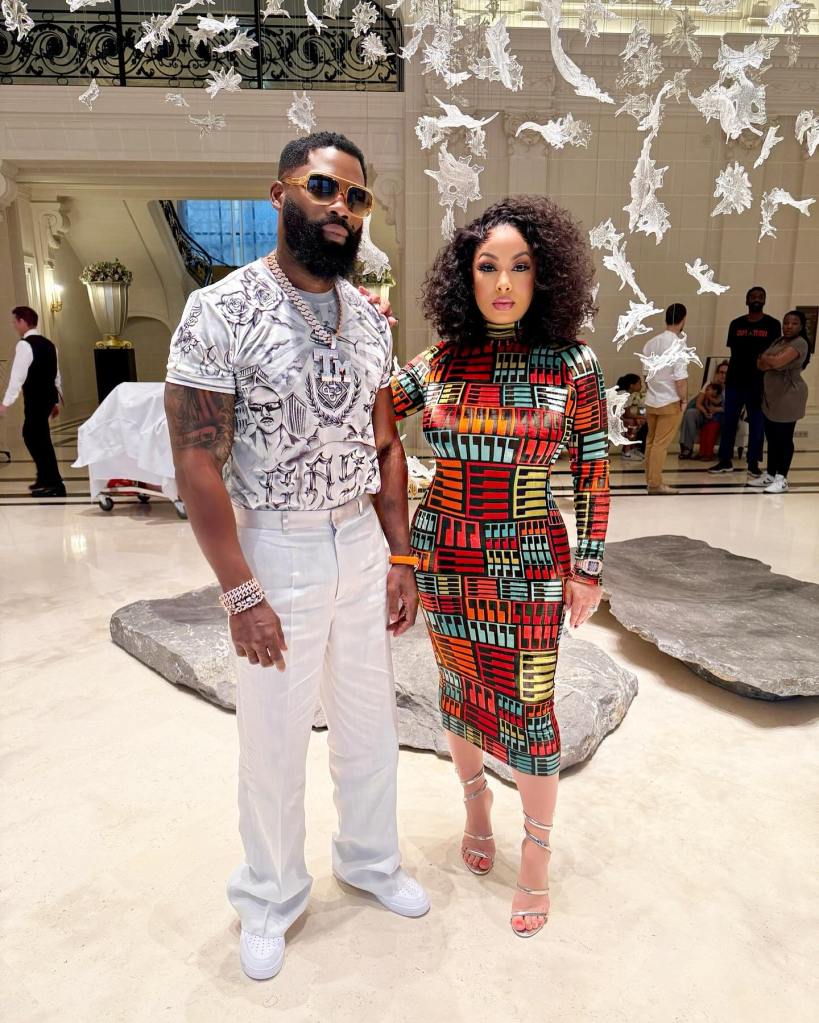 Igho "Tiny" Ubiribo and his wife posing together.