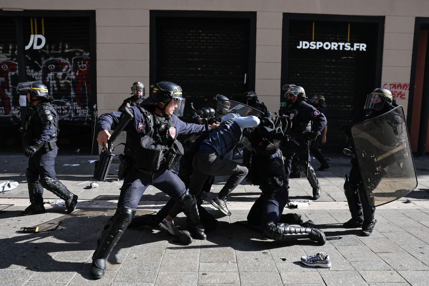 French police detain a protester during clashes prior to the start of a demonstration in Marseille, southern France, on Saturday, October 17, 2026.