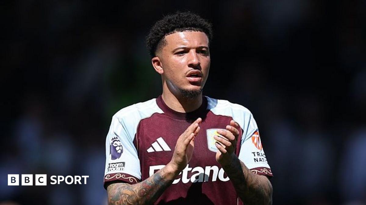 Jadon Sancho wearing an Aston Villa shirt