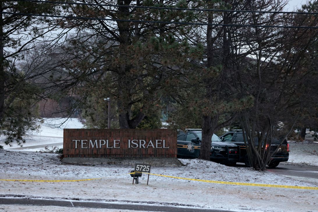 Law enforcement vehicles are parked outside Temple Israel guarding the scene in West Bloomfield, Michigan, on March 13, after a person identified as Ayman Mohamad Ghazali drove a vehicle into the building.