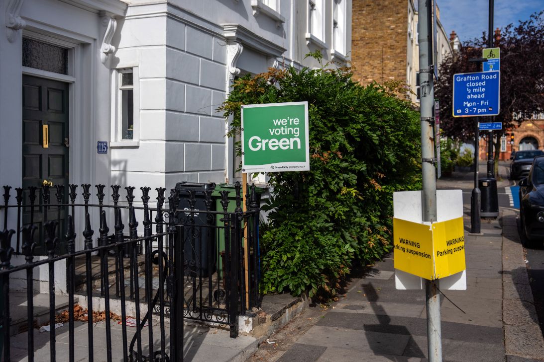 A Green Party sign displayed outside a house.