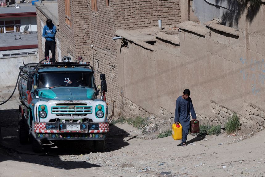 A water tanker on a hillside in Kabul. Residents have to lug water in heavy jugs from wells or buy it from tankers, which charge at least twice as much as the state-owned utility.