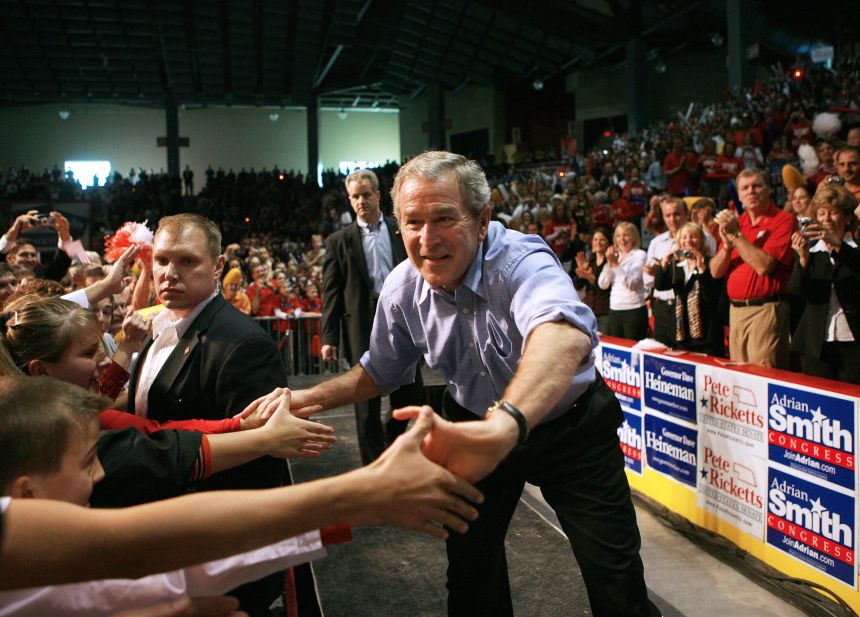President George W. Bush greets supporters as he arrives for a campaign rally at the Heatland Events Center in Grand Island, Nebraska, on November 5, 2006.