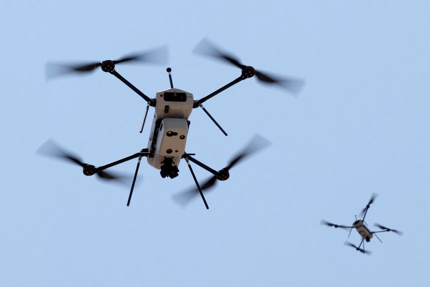 Drones produced by the Israel-based international defence electronics company Elbit Systems fly during a press demonstration at their headquarters in Israel on July 10, 2023.