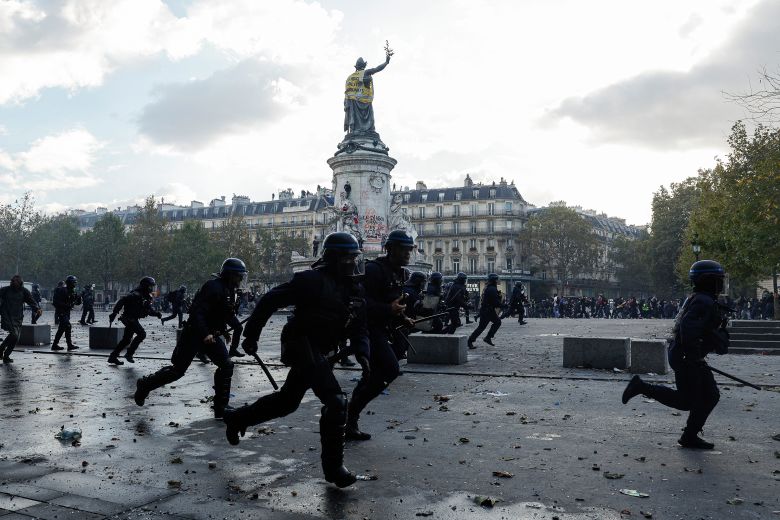 Police officers charge at demonstrators at Place de la Republique in Paris on Saturday, October 17, 2026.