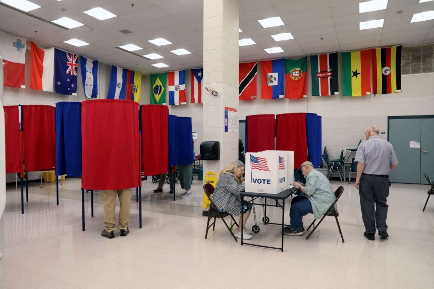 Voters fill out their ballots at a polling station in Nashua, New Hampshire, on September 8.