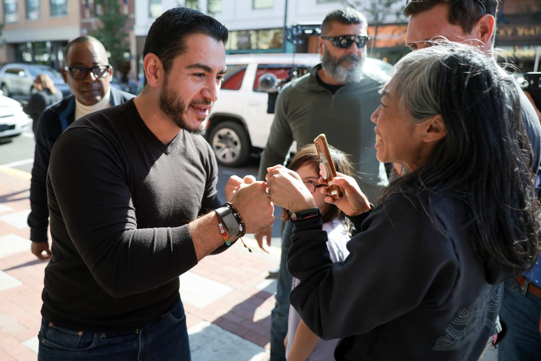 El-Sayed greets supporters who were not able to attend his campaign event after it reached maximum capacity at the State Theater in Traverse City, Michigan, on October 10.