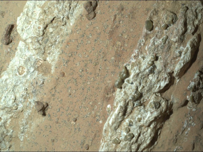 Leopard spot marks appear on a reddish Martian rock nicknamed Cheyava Falls.