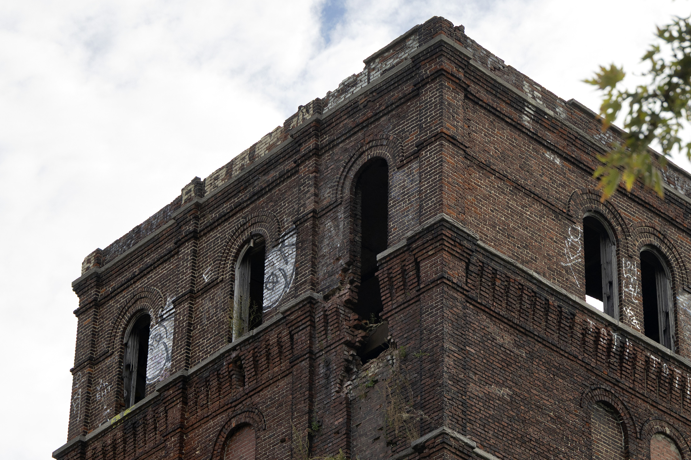 A closeup of the top of the Canada Malting plant, with some brick facade collapsed.
