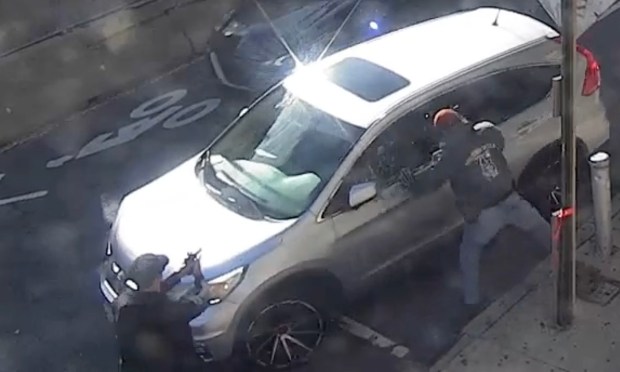 CCTV video shows ICE agents surrounding the car of Oscar Belgal on Marble Hill Ave. in Manhattan on Thursday, Oct. 8, 2026.