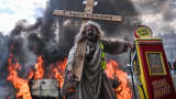 Protesters march through central Paris amid fires, smoke, police deployments and clashes during nationwide demonstrations against the high cost of living, on October 17, 2026 in Paris, France. 