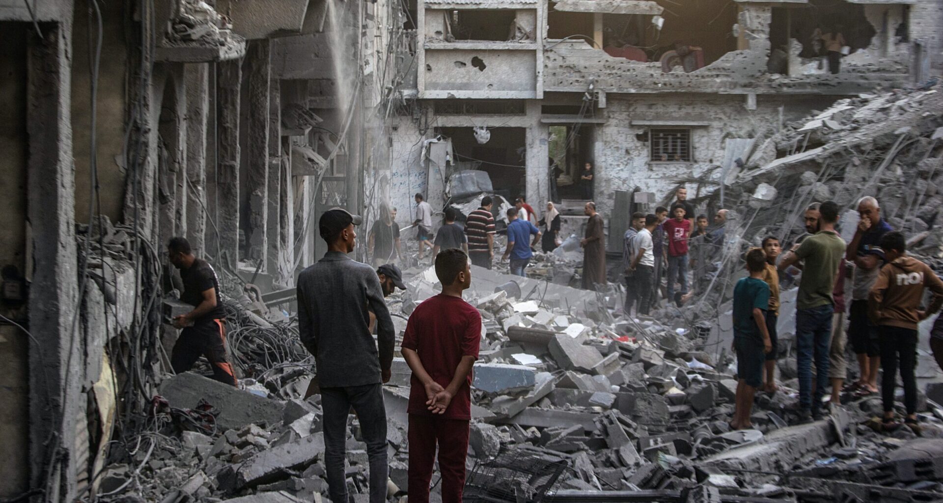 Palestinians inspect the rubble of destroyed homes following an Israeli airstrike in the Al-Sabra neighborhood of Gaza City on 9 October 2026, which killed at least three people, including an eight-year-old boy