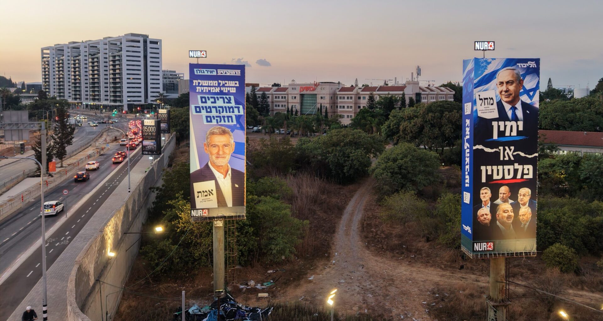 epa13312940 Election billboards featuring images of (R) Israeli Prime Minister Benjamin Netanyahu, and reading in Hebrew 'It's either the Right or Palestine,' and (L) Democratic Party leader Yair Golan are displayed in Ramat Gan near Tel Aviv, Israel, 18 October 2026. Israel will hold legislative elections on 27 October 2026.  EPA/ABIR SULTAN