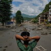 A boy looks at the devastation caused by flash flooding along the Trishuli River in Nepal's Nuwakot district on Wednesday.