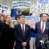 David Hearn (second from left) and his attorney Norman Eisen (right) addressed reporters after he entered his not guilty plea on July 9 in Washington, D.C.