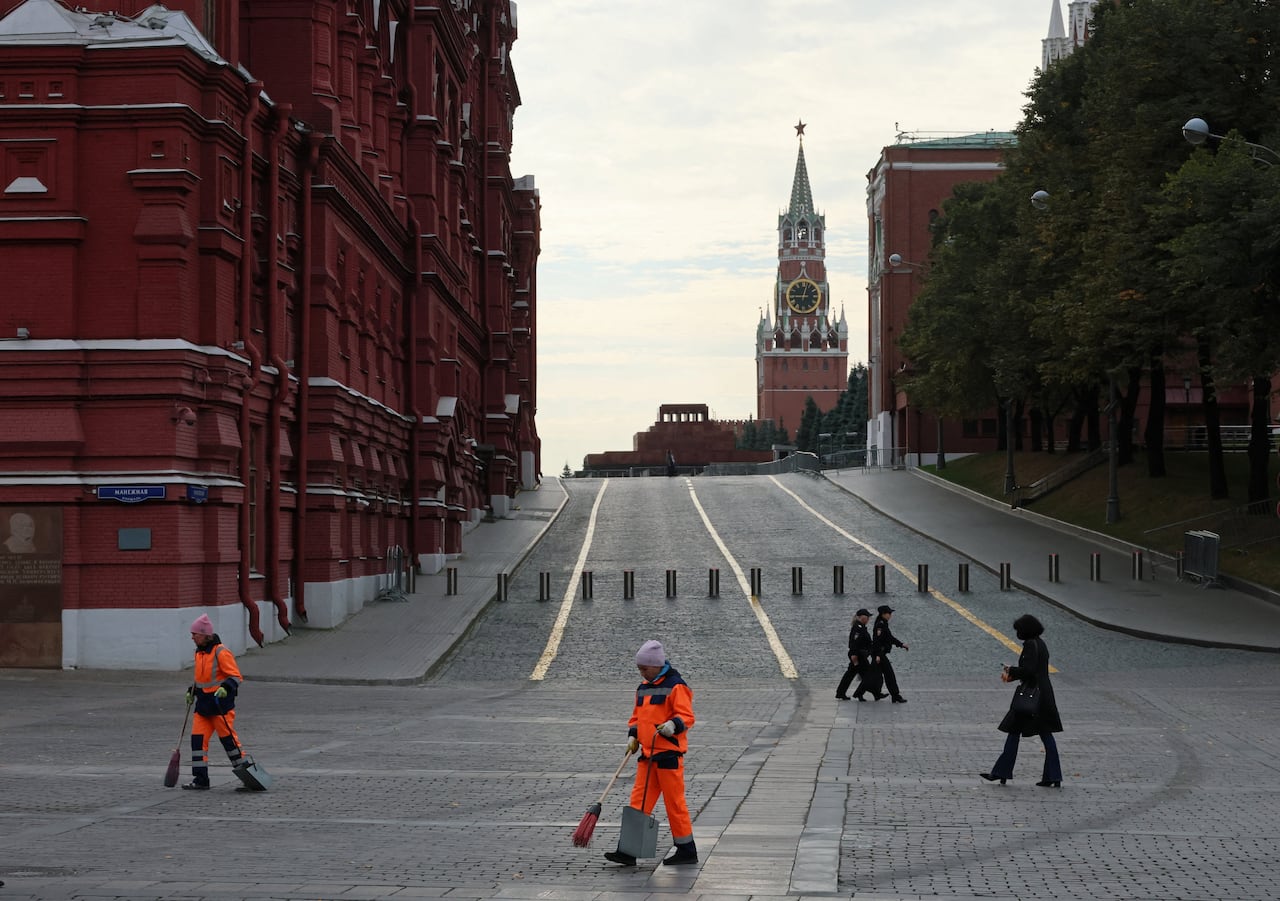 Municipal workers use broom to tidy an outdoor area near Moscow's Red Square in September 2026.