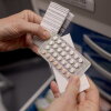 A nurse displays a set of birth control pills at Pima County Health Department's Northwest Clinic, which offers free reproductive health services for all ages through federal funding from Title X, in Tucson, Arizona, on Thursday, September 3, 2026.