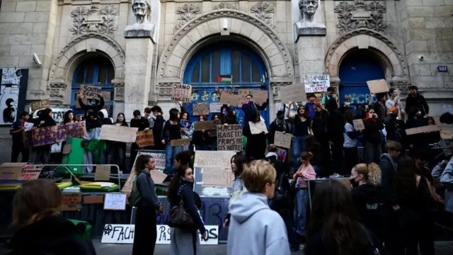 French high school students gather outside the Lycee Voltaire high school as part of nationwide protests to demand the hiring of substitute teachers, increased resources and better learning conditions