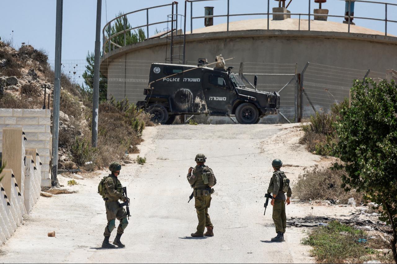Israeli soldiers patrol the road in the Palestinian village of Tell, in the Israeli-occupied West Bank on July 25, 2026, a day after four Palestinians and two Israelis died in local clashes in the village. (AFP Photo)