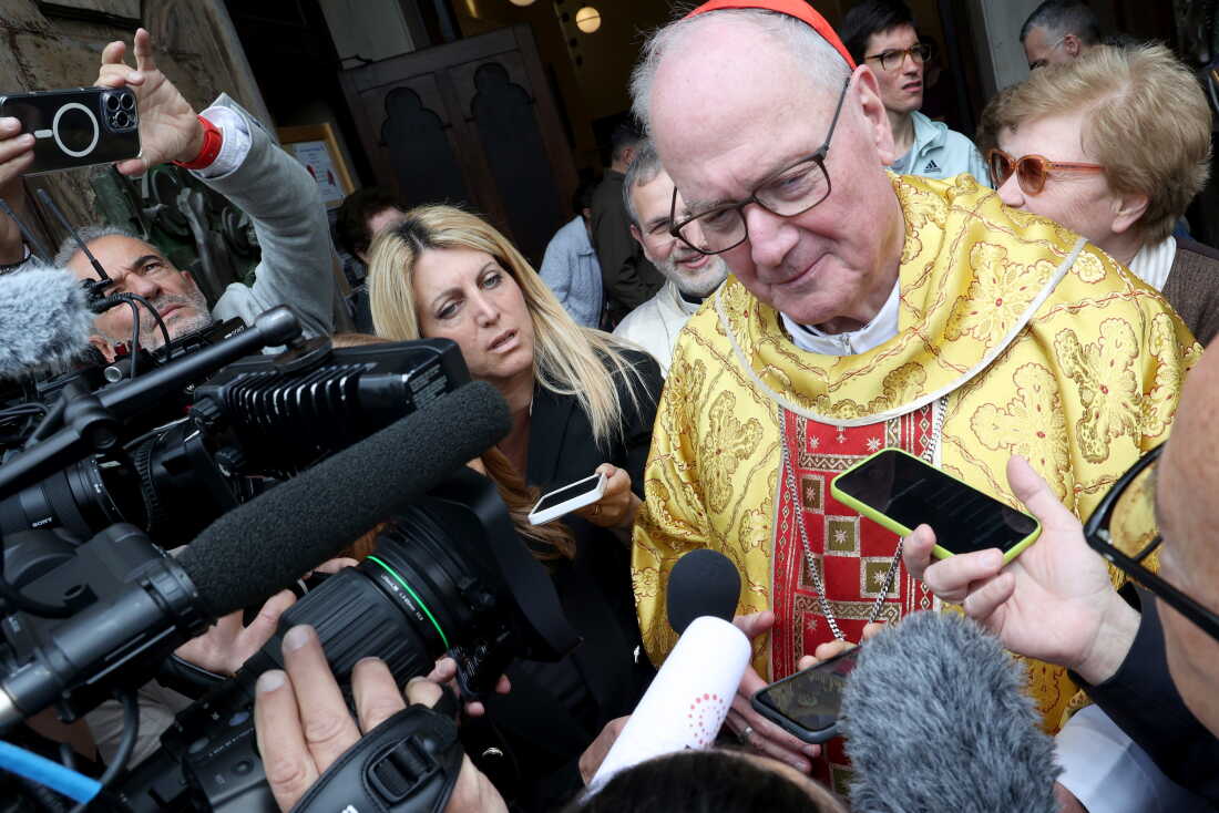 Cardinal Timothy Dolan, archbishop of New York, meets members of the media at the end of a Mass on May 4, 2025, in Rome.