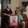 Bobbie (left) and DeForrest Williams hold a portrait of their son, Christian Williams, at their home in Buckeye, Ariz. Christian died at age 15 of diabetes complications while in a residential foster care program.