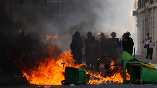 Macron government struggles to quell protests as riot police clash with high schoolers