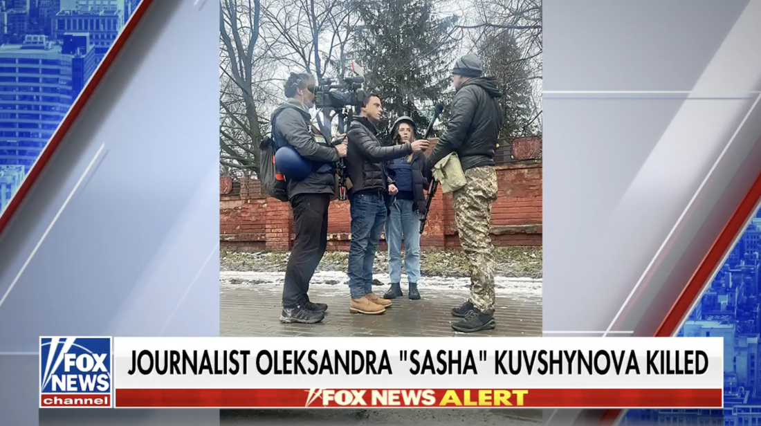 This screenshot from Fox News shows Oleksandra Kuvshynova standing outdoors with two other members of a news crew β one holding a microphone and the other holding a TV camera β as they interview a man wearing camouflage pants and carrying a firearm. The text at the bottom of the screen says: "Journalist Oleksandra 'Sasha' Kuvshynova Killed."