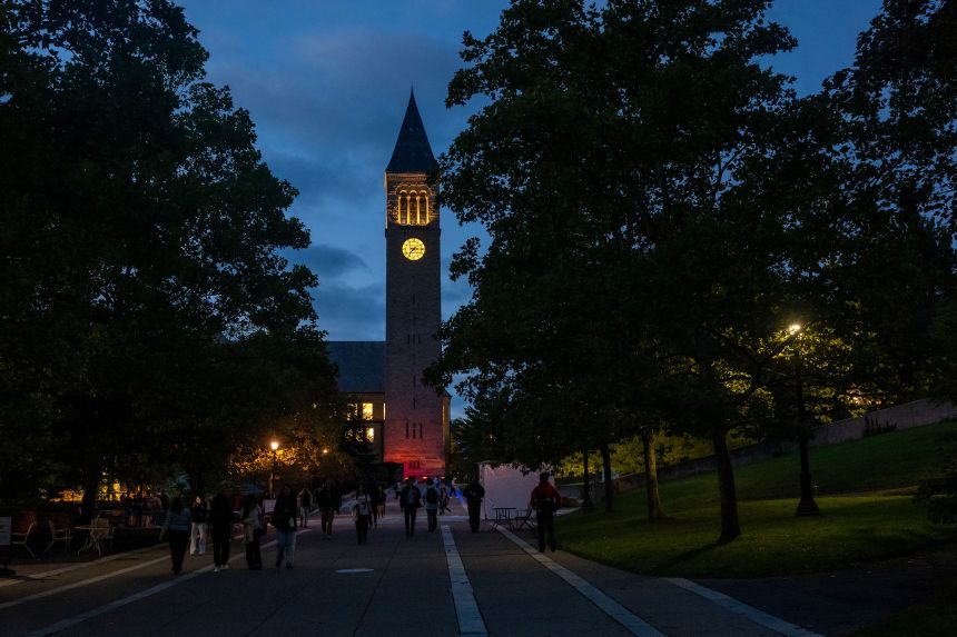 Students walk on the campus of Cornell University in Ithaca, New York, on September 29.