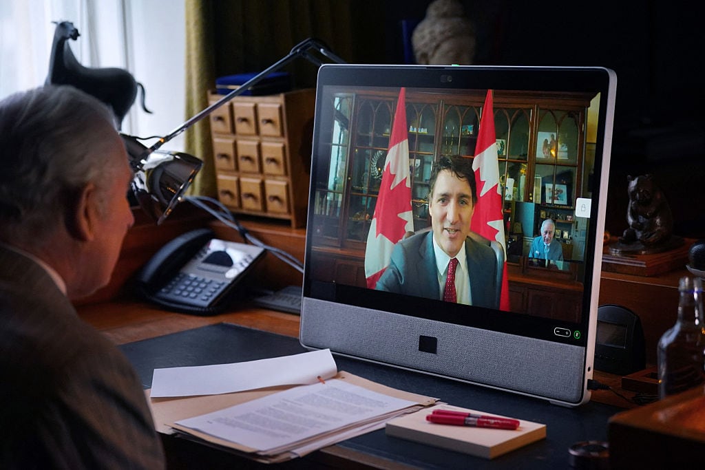 Two people chat by video conference.