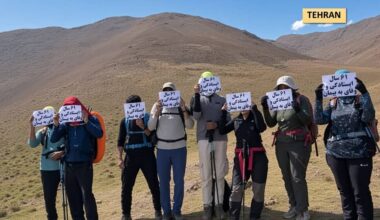 MEK Resistance Units on a mountain hike near Tehran, September 6, 2026, marking the organization’s 61st anniversary. Their signs read “61 years of steadfastness and loyalty to the pledge