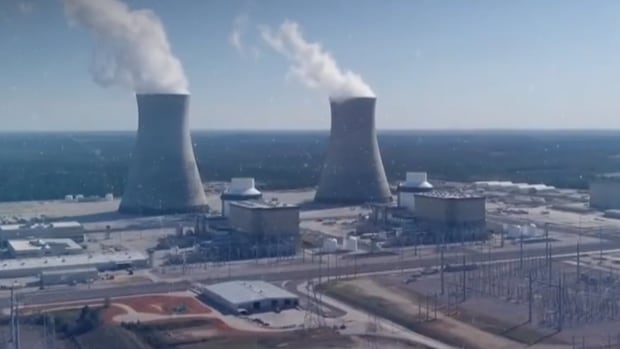 How would 2 large nuclear reactors affect Saskatchewan's economy and land?