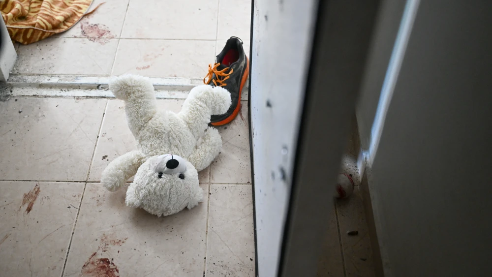 A teddy bear is seen left on the ground near the bomb shelter of a kibbutz home attacked by Hamas on Oct. 7 in Holit, Nov. 1, 2023. Photo by Alexi J. Rosenfeld/Getty Images.