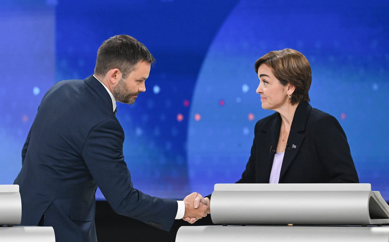 Quebec Conservative Leader Eric Duhaime shakes hands with Coalition Avenir Quebec Leader Christine Frechette following a leaders debate in Montreal on Wednesday, Sept. 23, 2026. Quebec votes in a provincial election on Oct. 5, 2026.