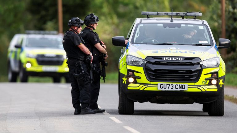 Armed police officers outside RAF Fairford airbase on 28 September. Pic: Reuters